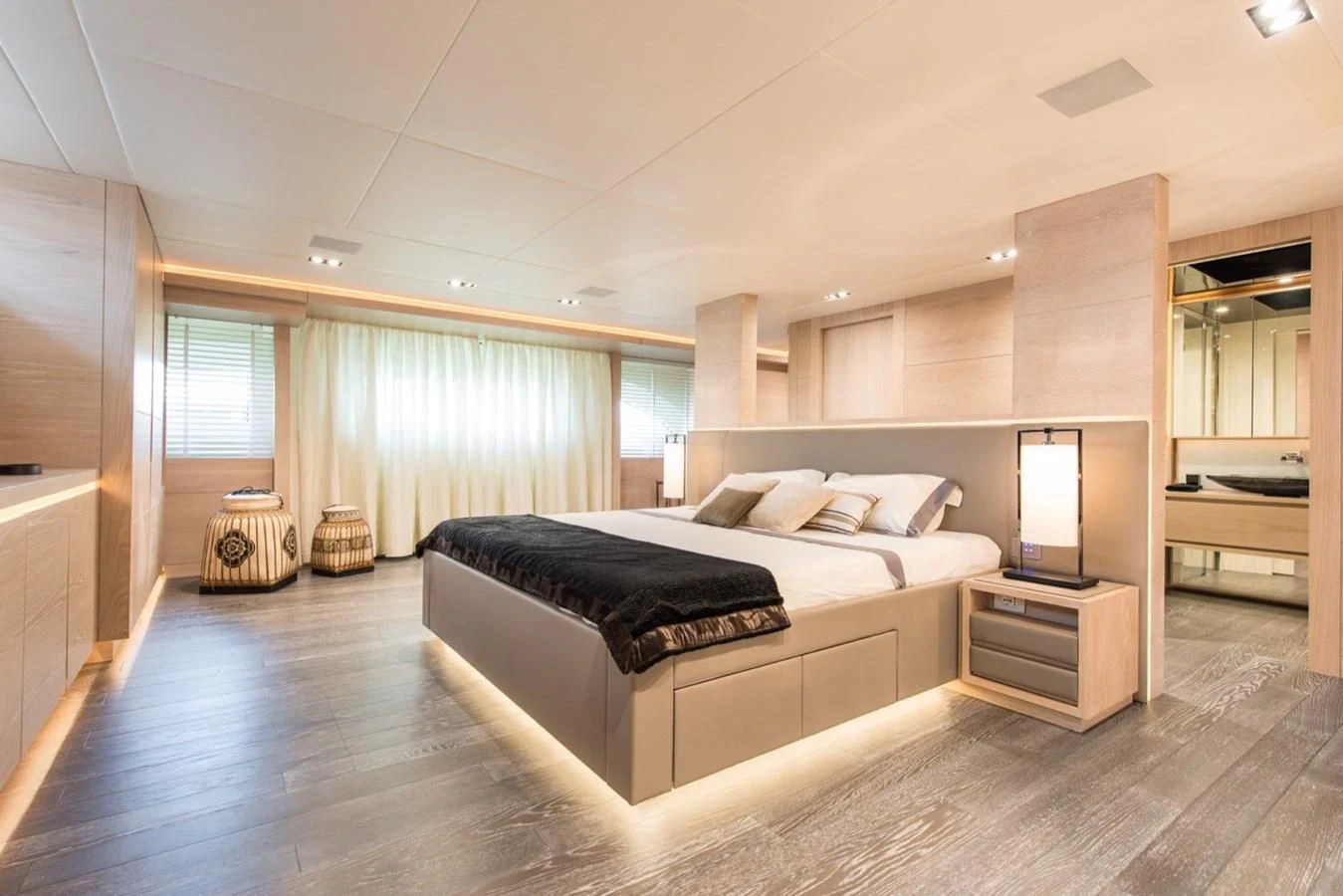 a large bedroom with a large bed aboard FAST & FURIOUS Yacht for Charter