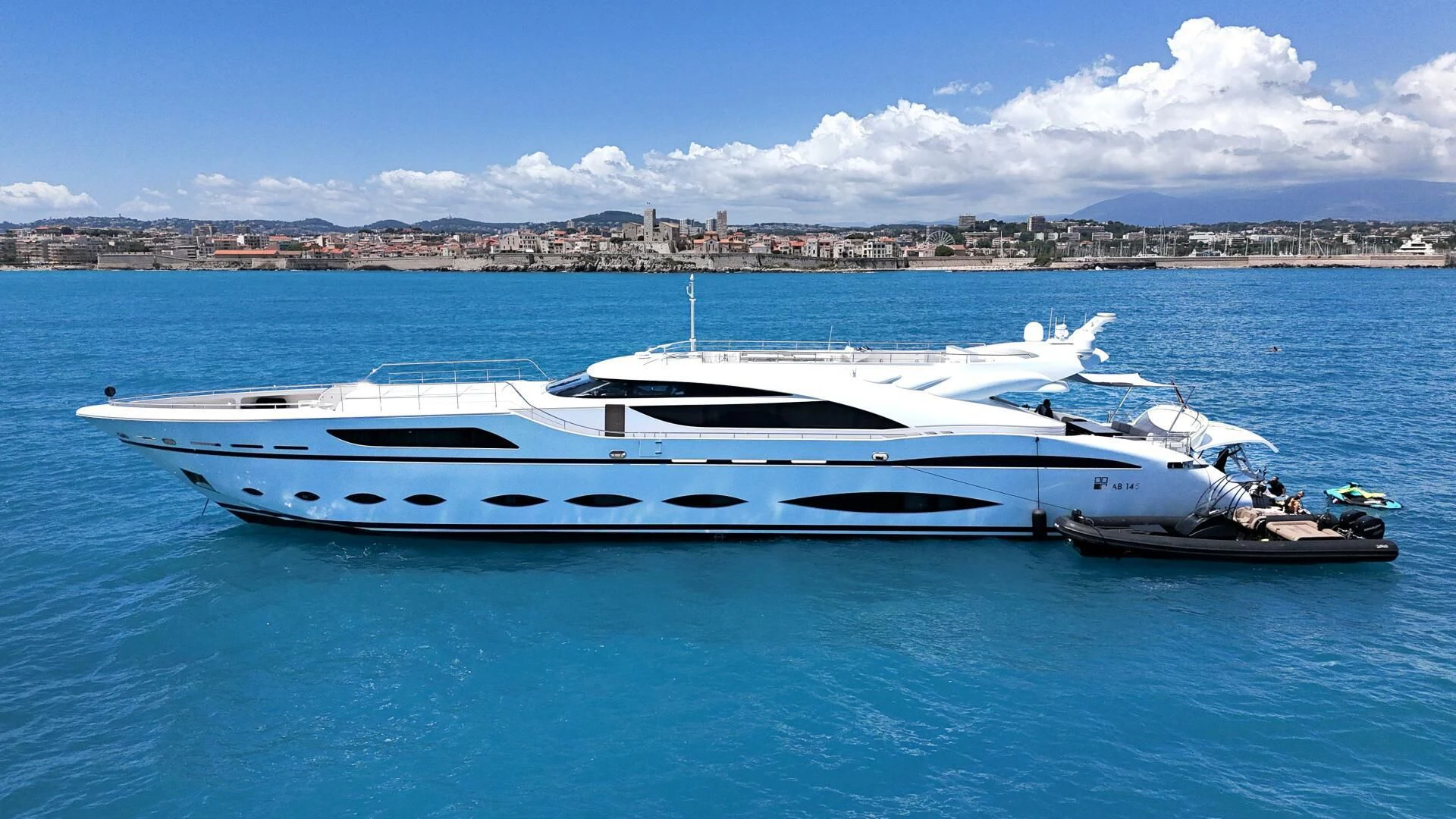 a white yacht in the water aboard FAST & FURIOUS Yacht for Charter
