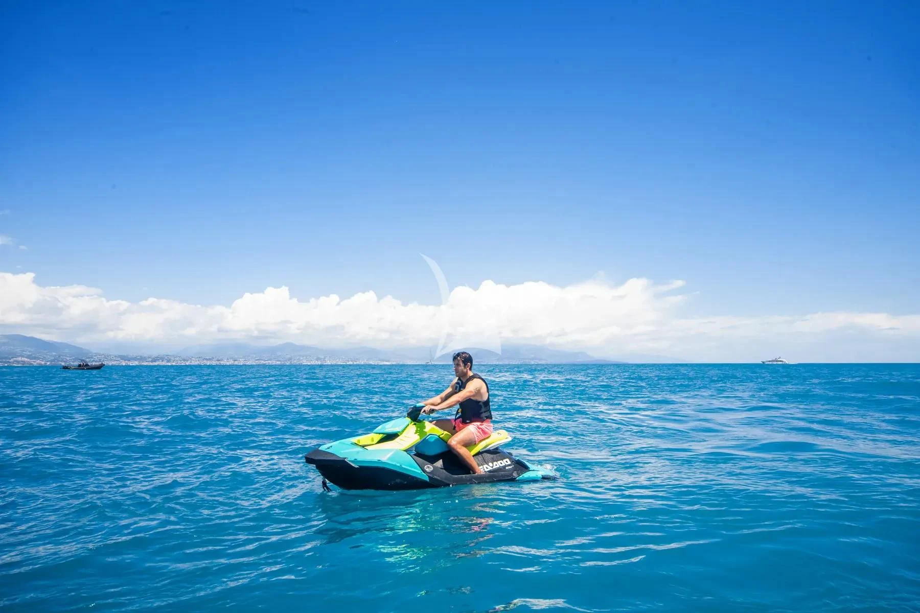a man and a woman on a raft in the water aboard FAST & FURIOUS Yacht for Charter