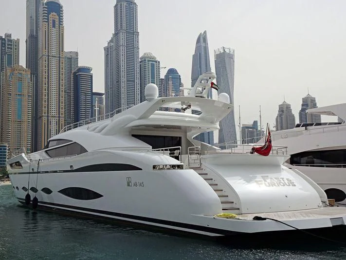 a white yacht in the water aboard FAST & FURIOUS Yacht for Charter