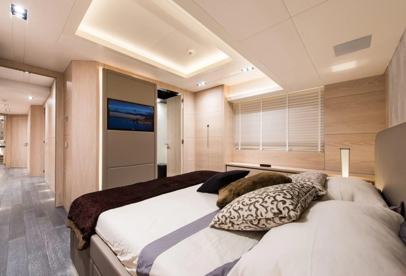 a bedroom with a bed aboard FAST & FURIOUS Yacht for Charter