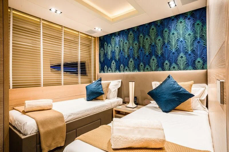 a room with two beds aboard FAST & FURIOUS Yacht for Charter