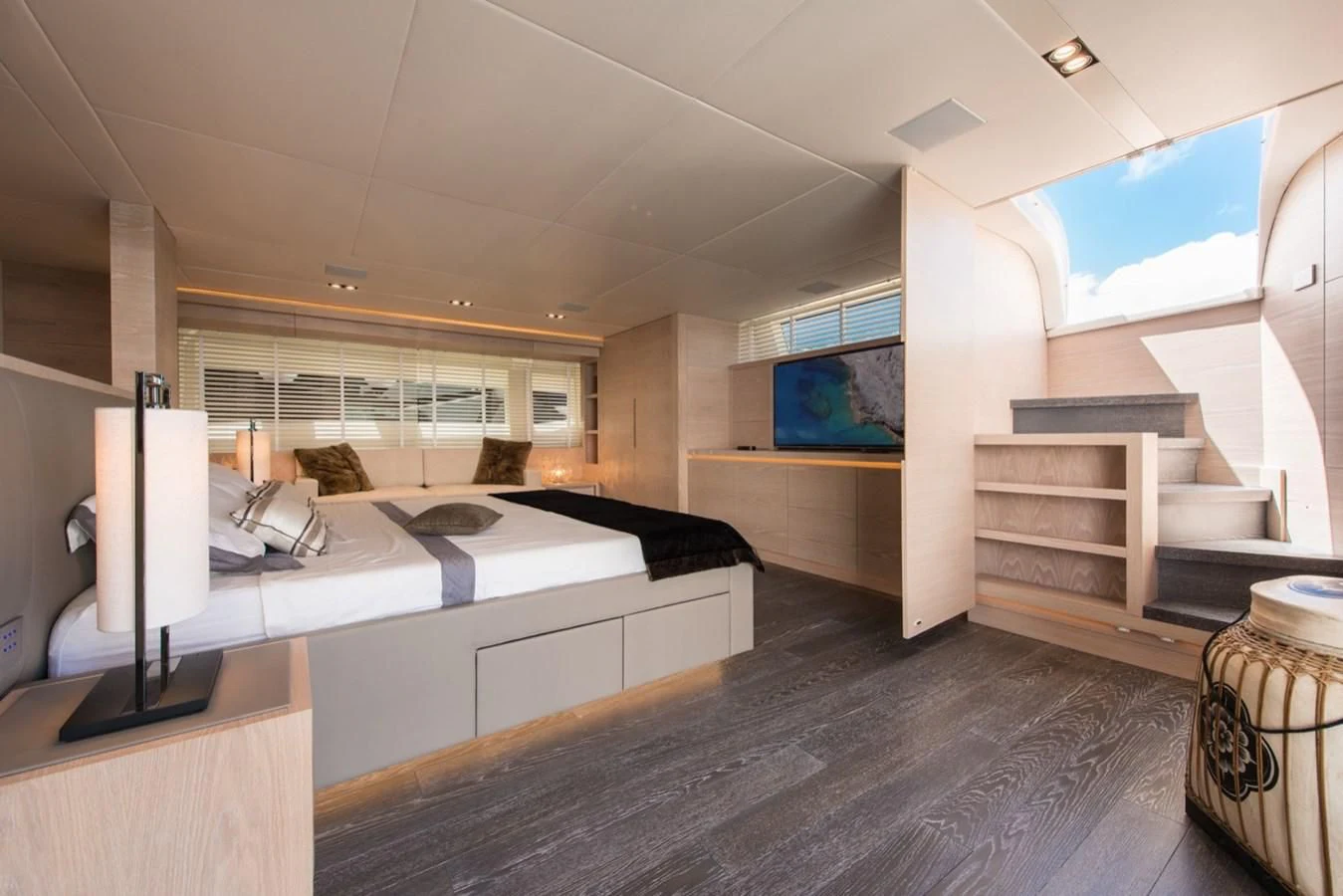 a large room with a large bed aboard FAST & FURIOUS Yacht for Charter