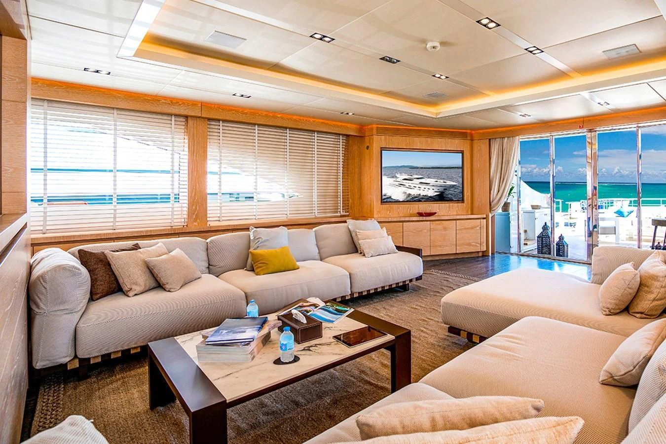 a living room with a large window aboard FAST & FURIOUS Yacht for Charter