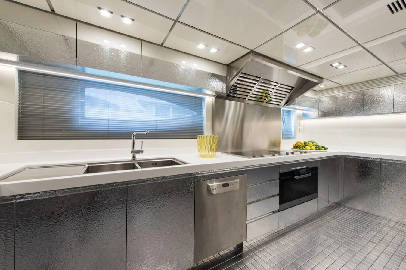 a kitchen with a large island aboard FAST & FURIOUS Yacht for Charter
