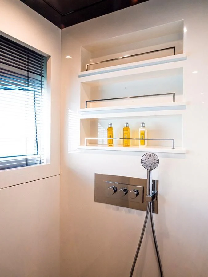 a shelf with a variety of bottles on it aboard FAST & FURIOUS Yacht for Charter