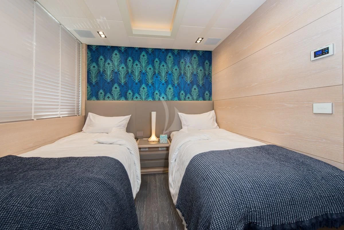 a couple of beds in a room aboard FAST & FURIOUS Yacht for Charter