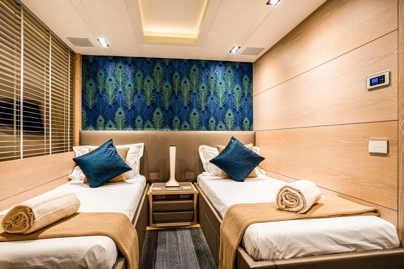 a room with a couple of beds aboard FAST & FURIOUS Yacht for Charter