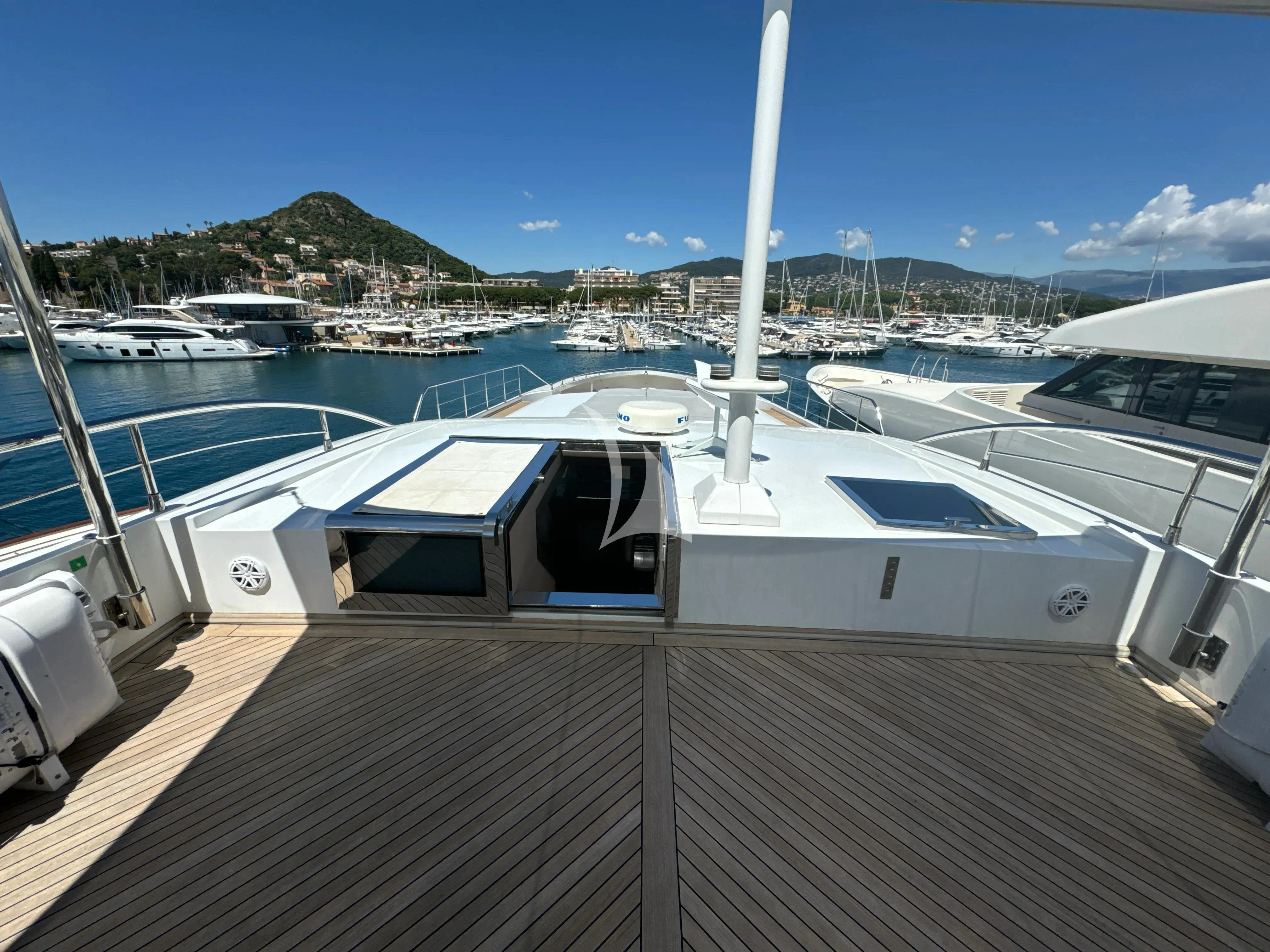 a boat docked at a pier aboard FAST & FURIOUS Yacht for Charter