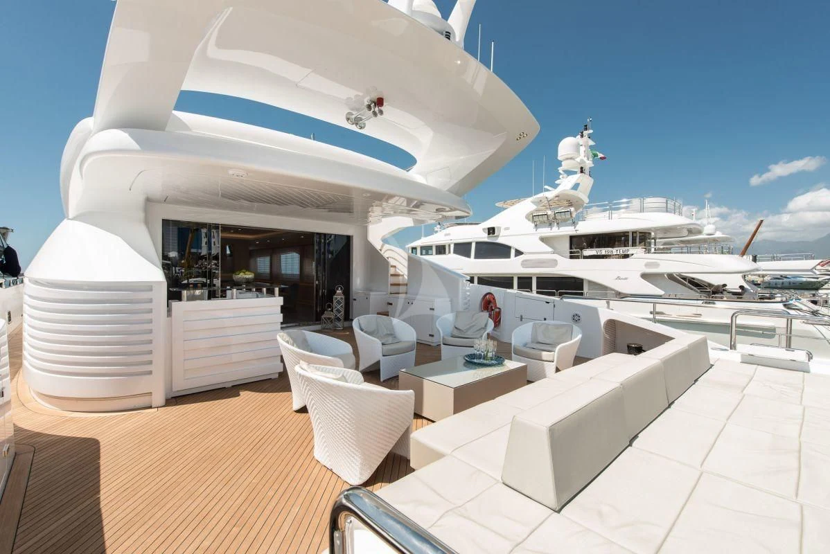 a large white building with a large white boat and a statue on top aboard FAST & FURIOUS Yacht for Charter
