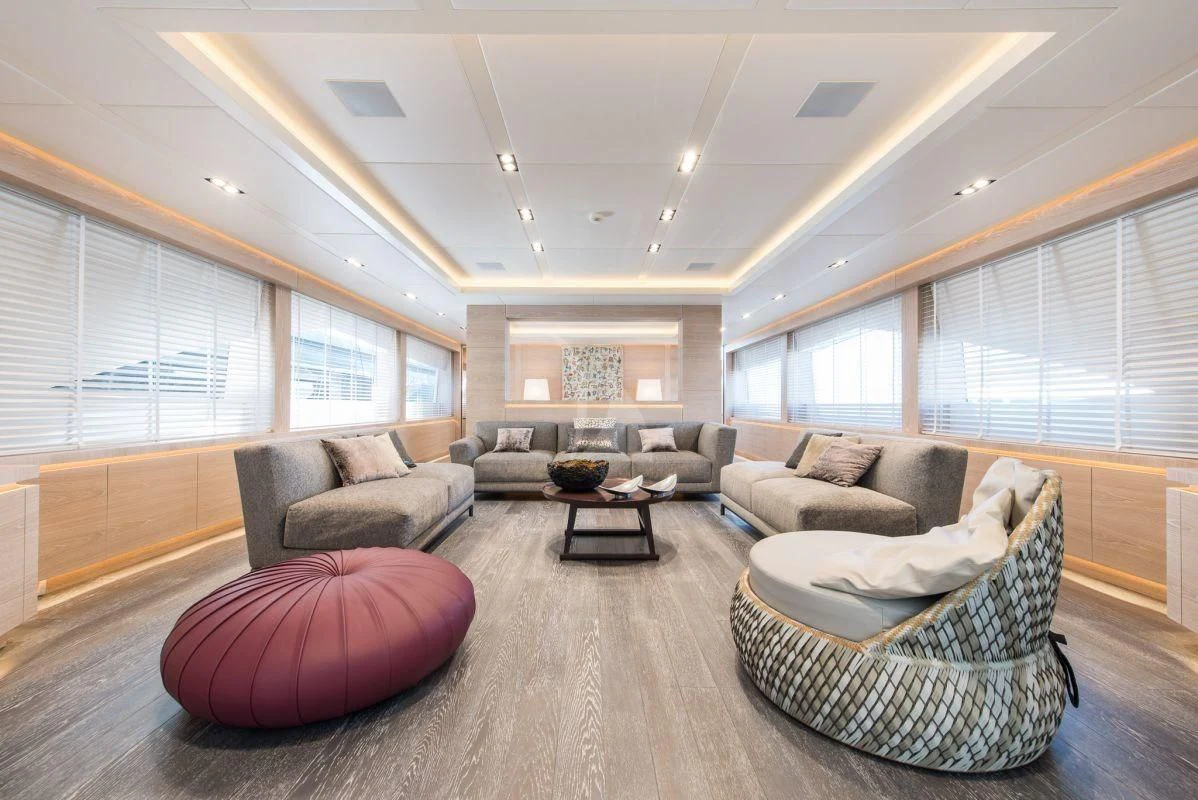 a living room with a large window aboard FAST & FURIOUS Yacht for Charter
