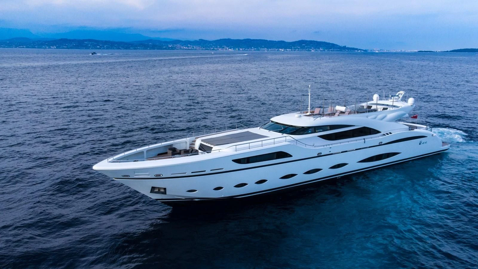 a white yacht in the water aboard FAST & FURIOUS Yacht for Charter