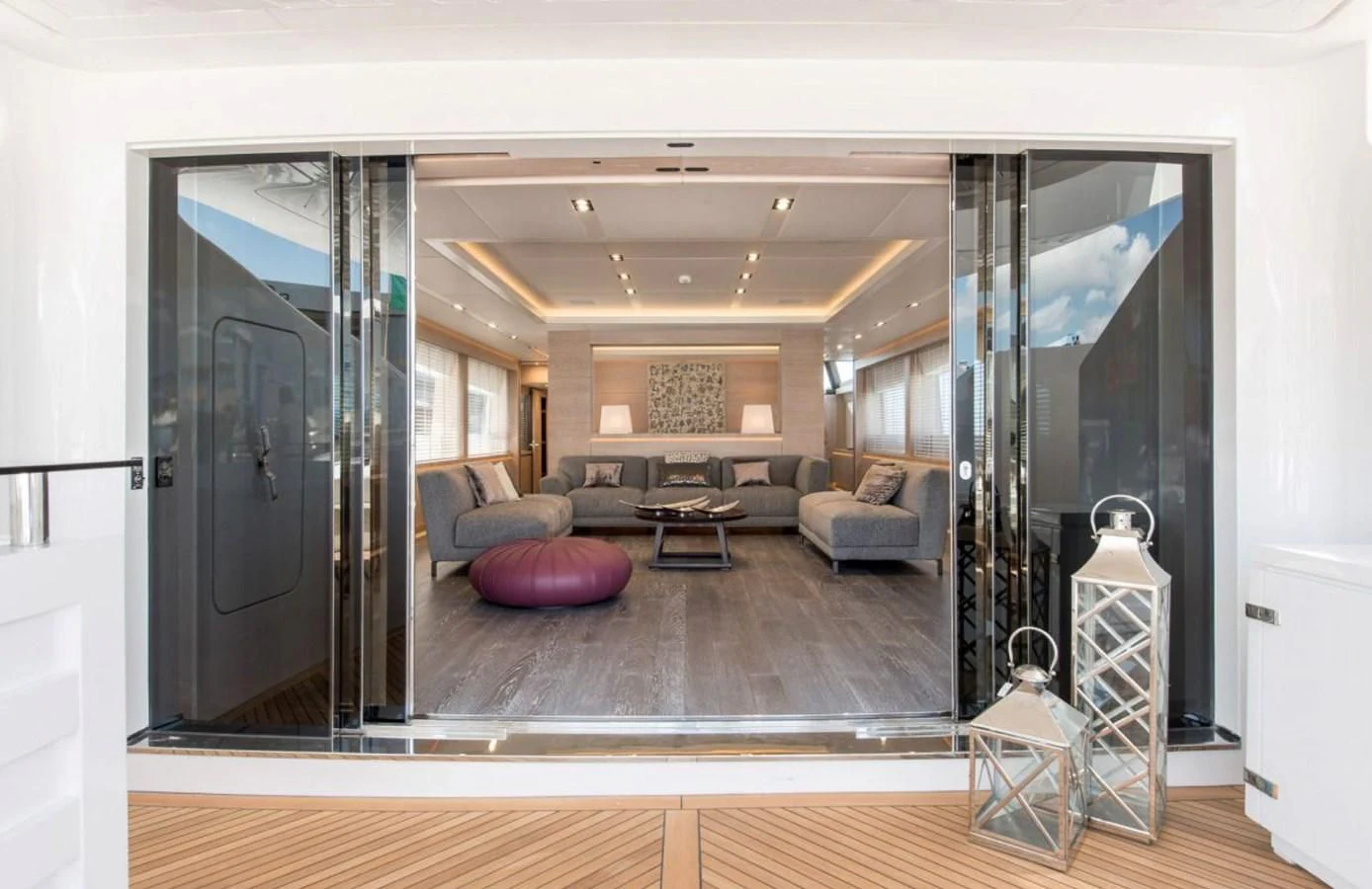 a living room with a large mirror aboard FAST & FURIOUS Yacht for Charter