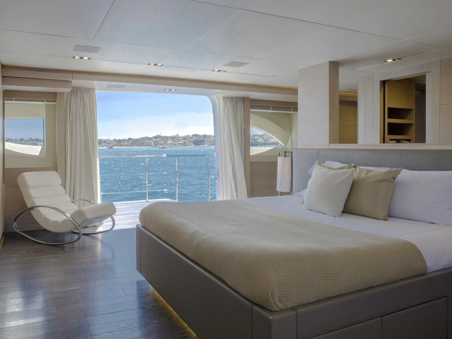 a bed with a white bed aboard FAST & FURIOUS Yacht for Charter
