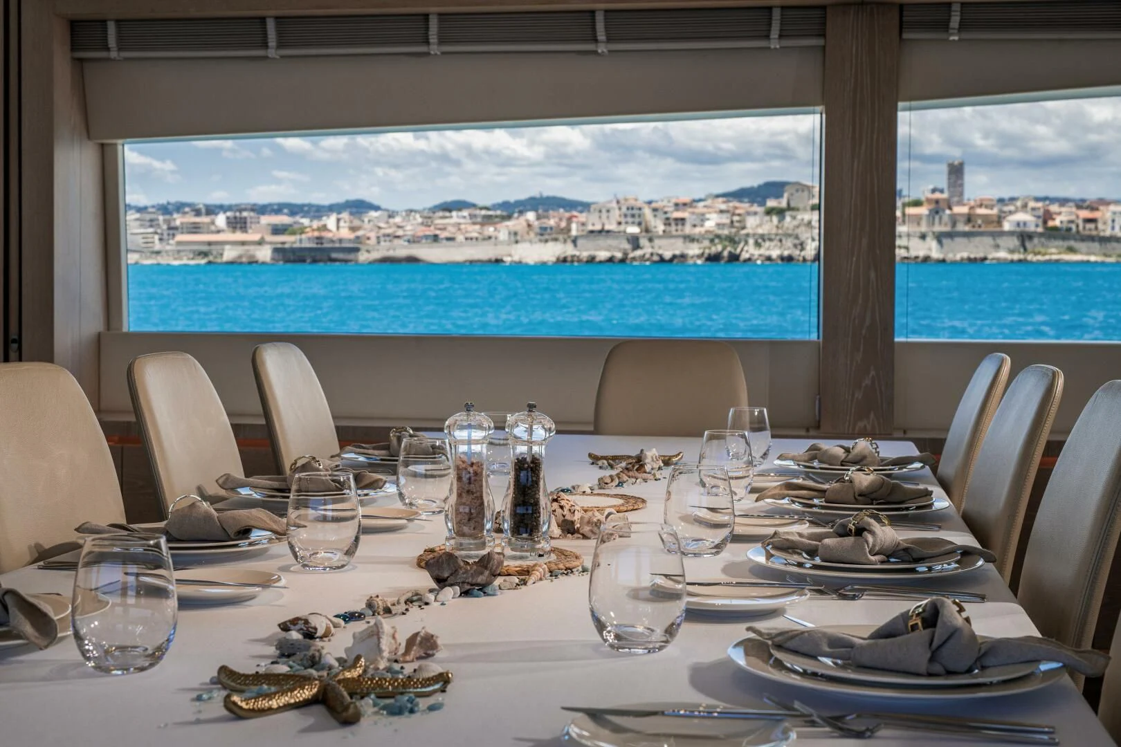 a table set for a dinner aboard FAST & FURIOUS Yacht for Charter
