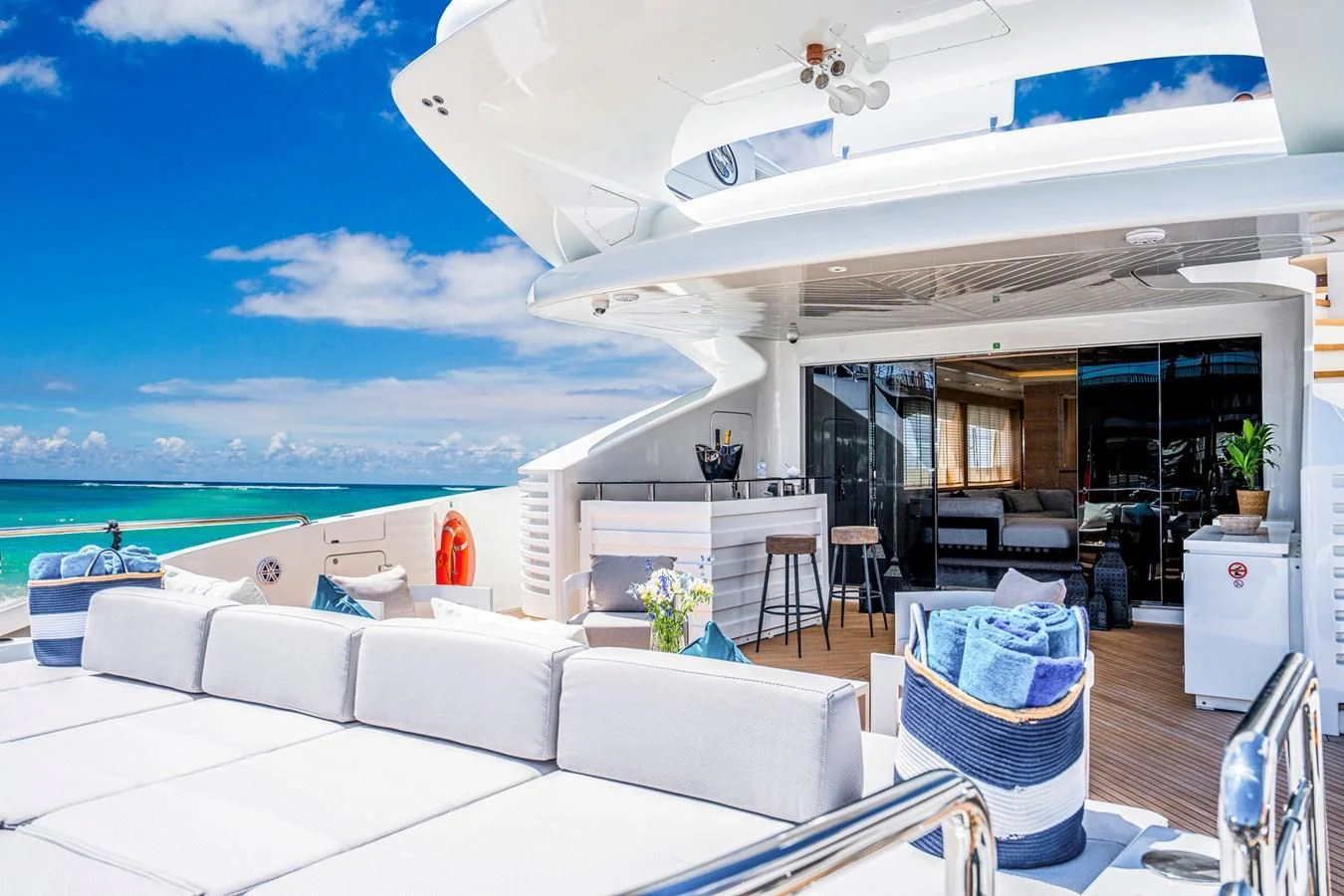 a room with a couch and a pool aboard FAST & FURIOUS Yacht for Charter