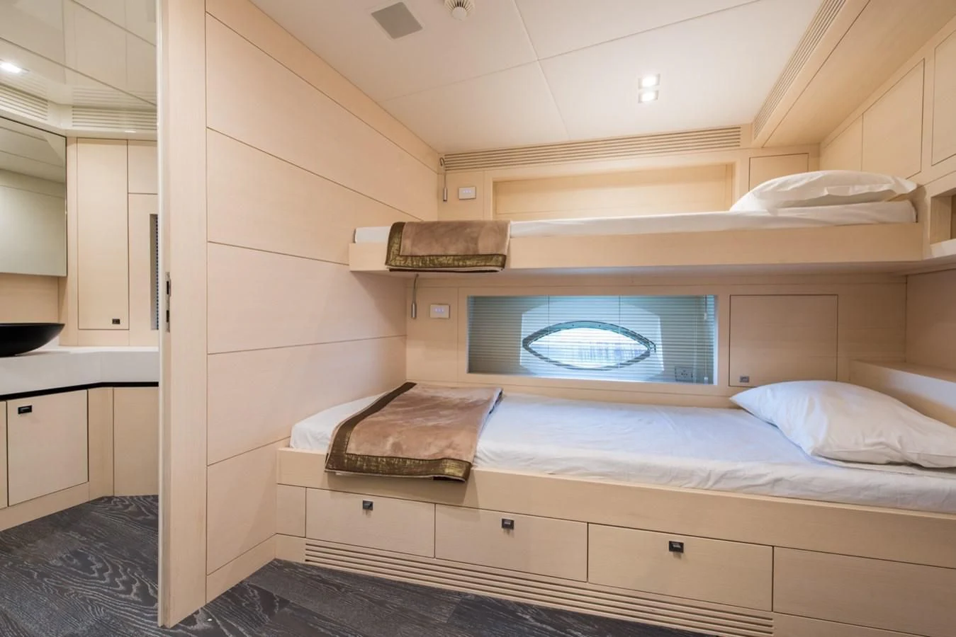 a room with a bed and a television aboard FAST & FURIOUS Yacht for Charter