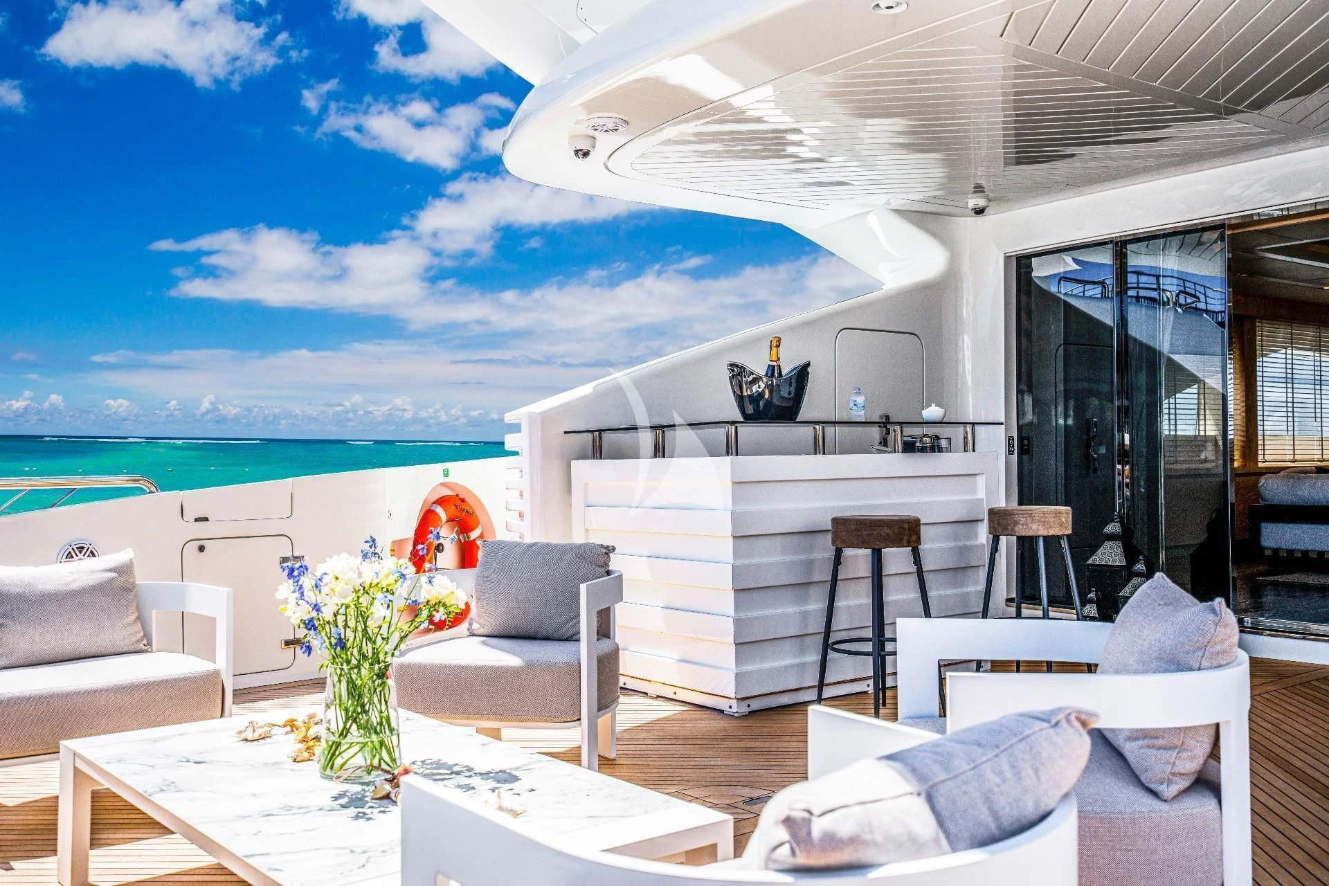 a modern house with a large swimming pool aboard FAST & FURIOUS Yacht for Charter