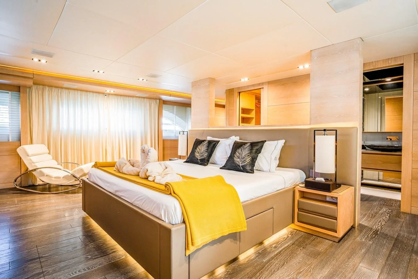 a bedroom with a bed and a tv aboard FAST & FURIOUS Yacht for Charter