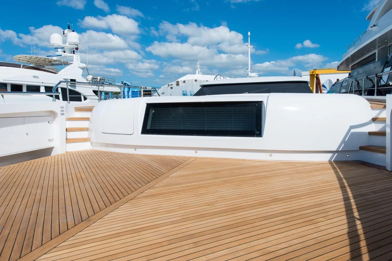 a deck with a boat and a deck with a deck and a blue sky aboard FAST & FURIOUS Yacht for Charter