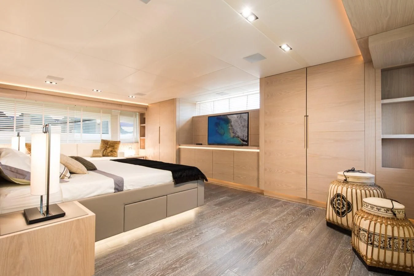 a room with a bed and a tv aboard FAST & FURIOUS Yacht for Charter