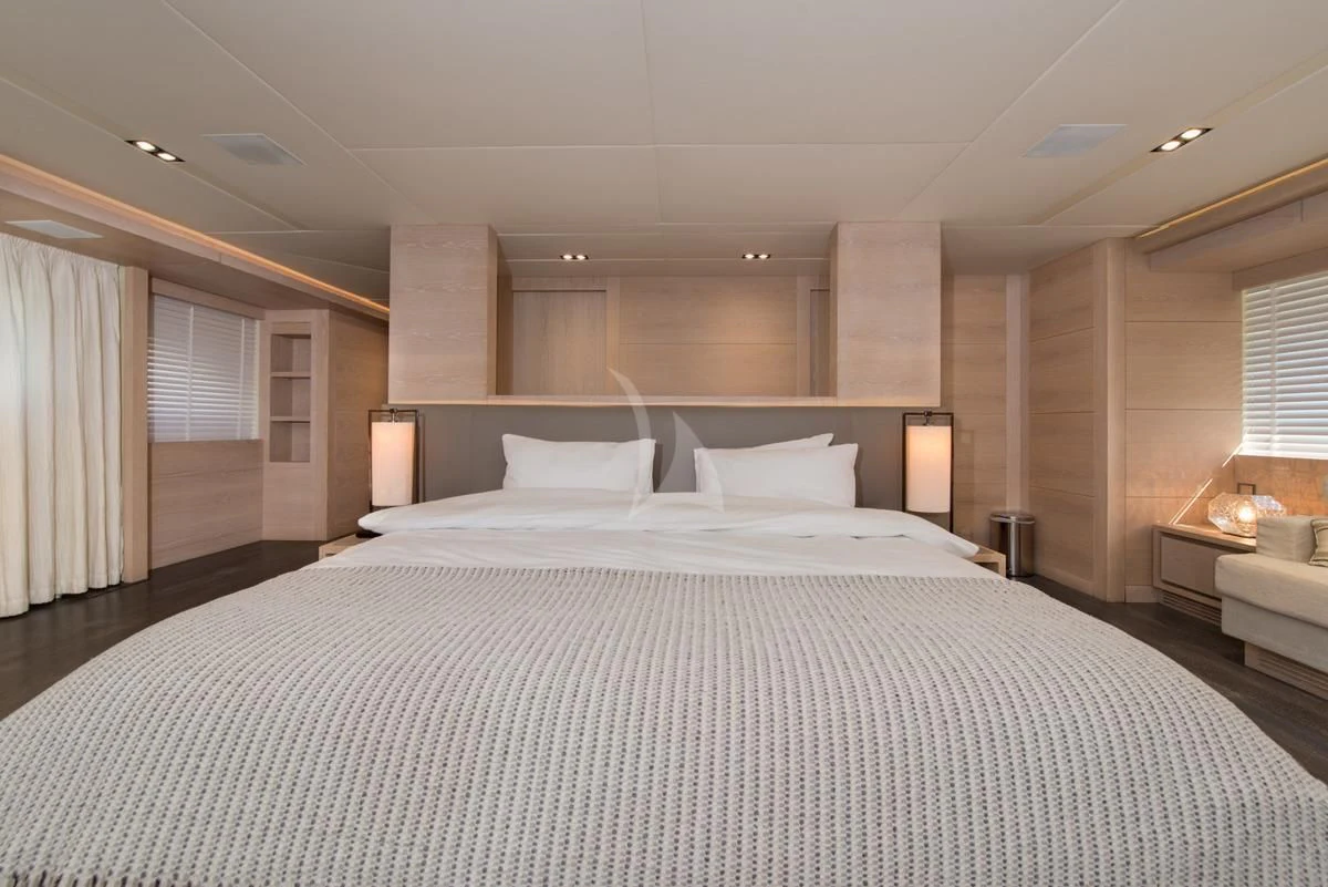 a large bed in a hotel room aboard FAST & FURIOUS Yacht for Charter