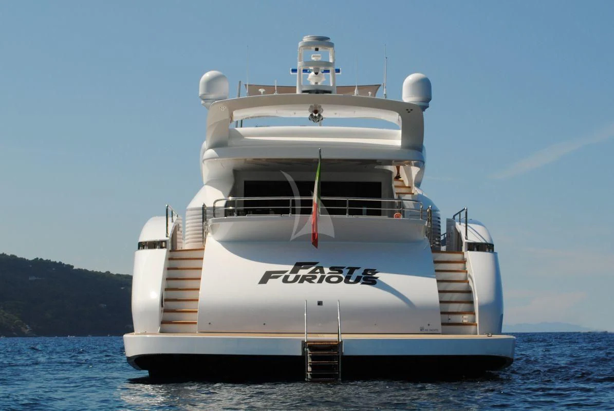 a large white ship in the water aboard FAST & FURIOUS Yacht for Charter