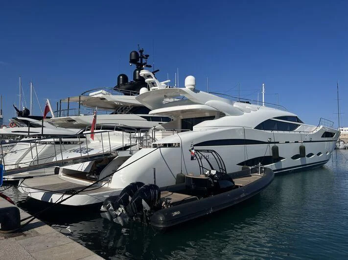 a boat docked at a pier aboard FAST & FURIOUS Yacht for Charter