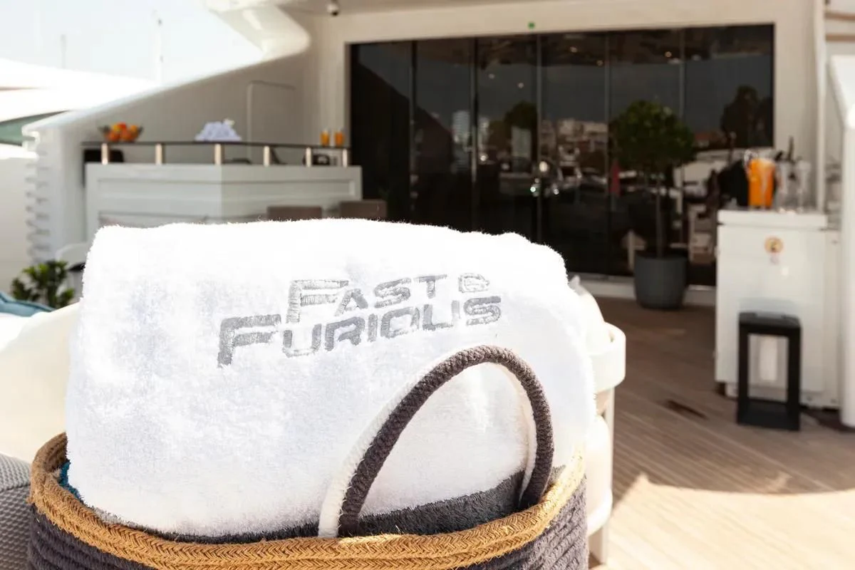 a hat on a table aboard FAST & FURIOUS Yacht for Charter