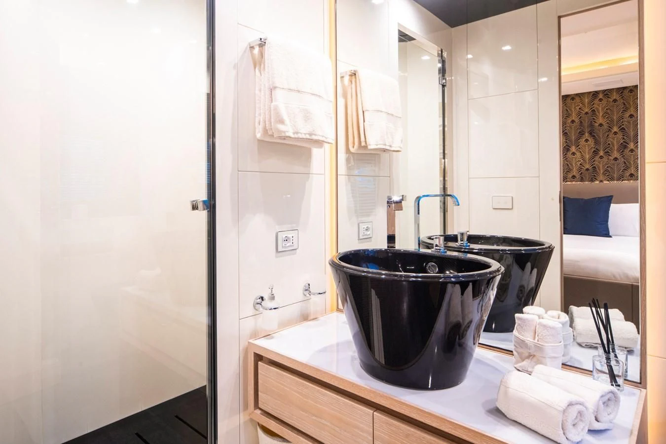 a bathroom with a sink and a mirror aboard FAST & FURIOUS Yacht for Charter