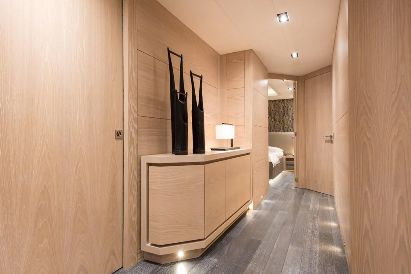 a hallway with a closet and a bed aboard FAST & FURIOUS Yacht for Charter
