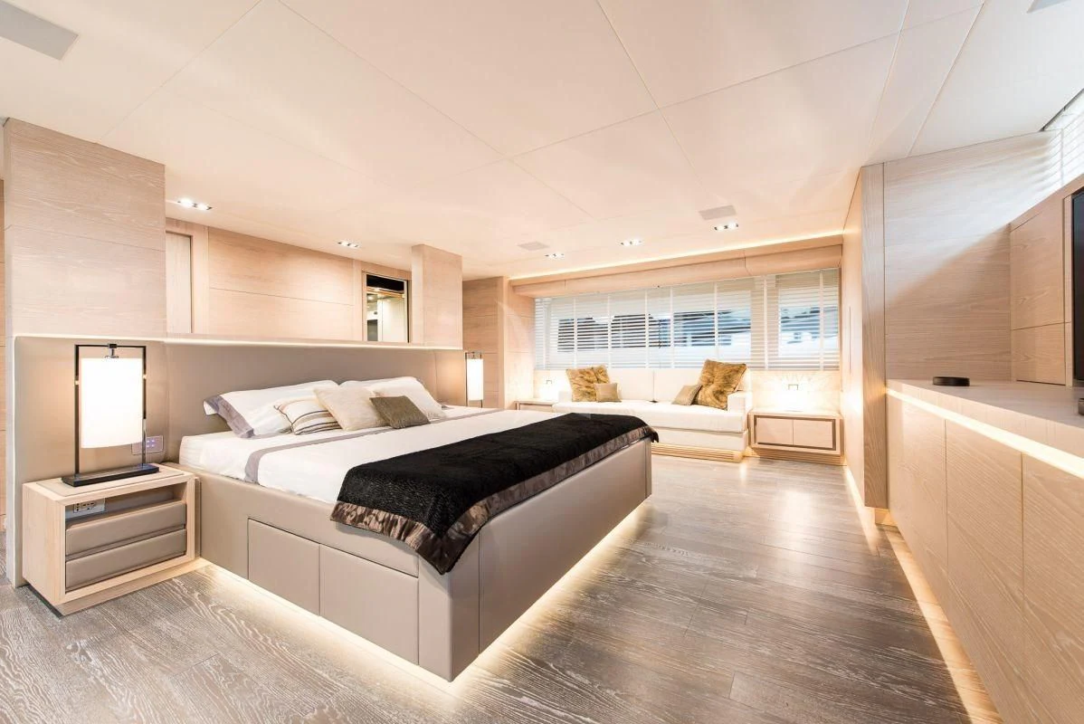 a room with a bed and a tv aboard FAST & FURIOUS Yacht for Charter