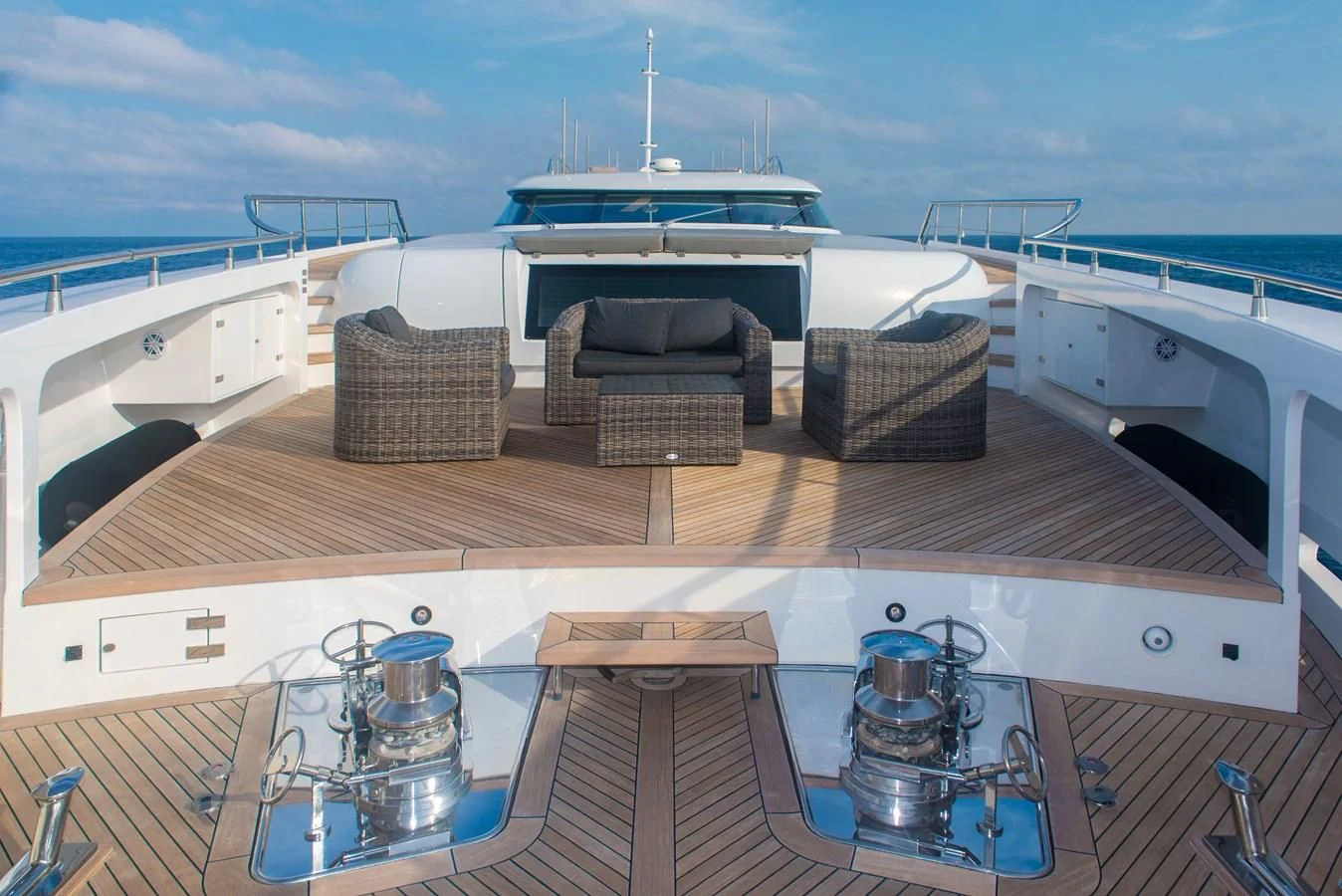 a deck with a deck and chairs on it aboard FAST & FURIOUS Yacht for Charter
