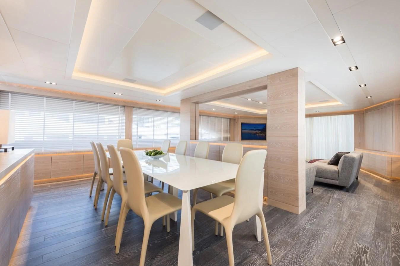 a large room with a table and chairs aboard FAST & FURIOUS Yacht for Charter