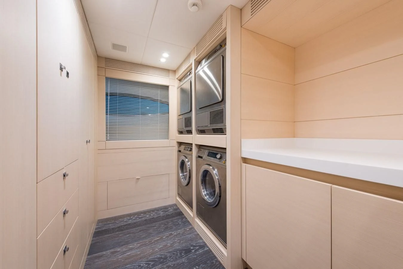 a small kitchen with white cabinets aboard FAST & FURIOUS Yacht for Charter