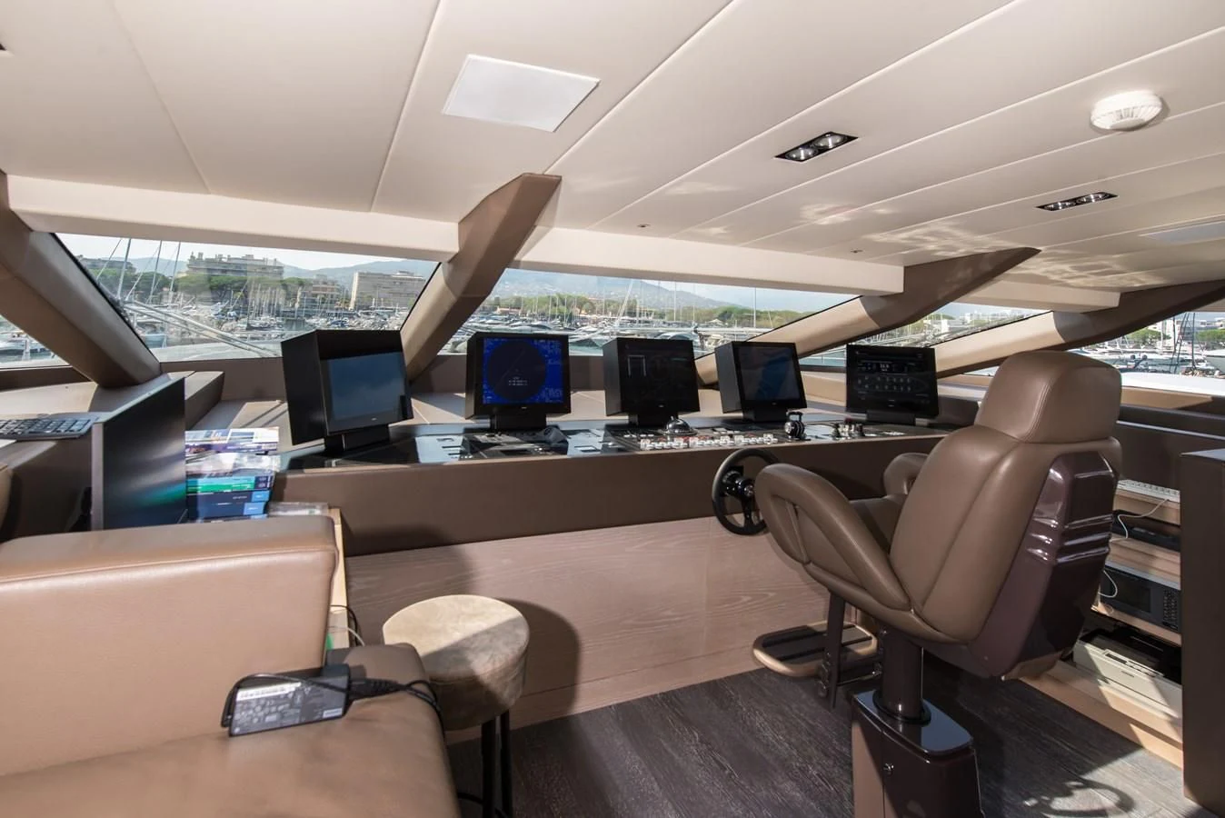 a room with a desk and chairs aboard FAST & FURIOUS Yacht for Charter