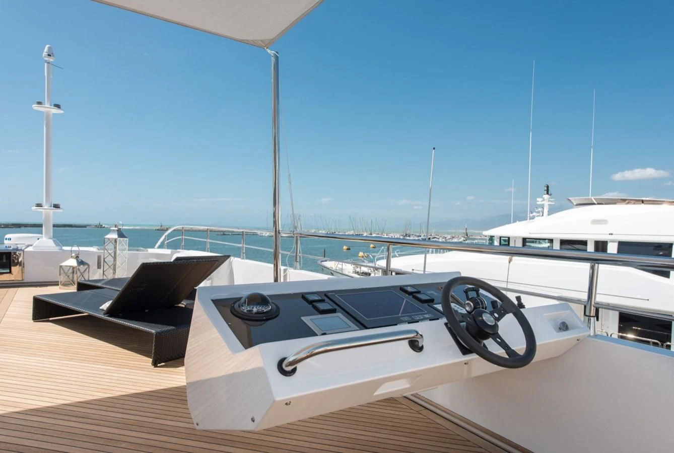 a model of a boat on a dock aboard FAST & FURIOUS Yacht for Charter