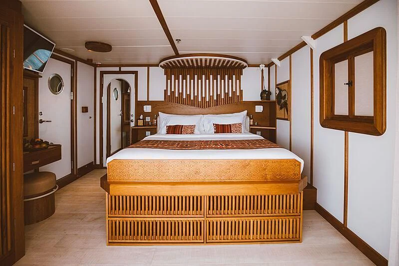 a bed in a room aboard KUDANIL EXPLORER Yacht for Sale