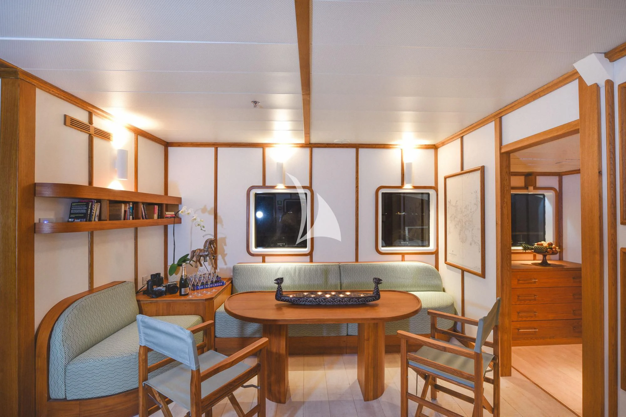 a room with a table and chairs aboard KUDANIL EXPLORER Yacht for Sale