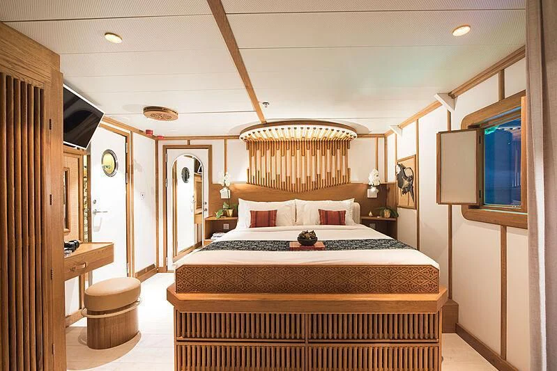 a bed with a canopy aboard KUDANIL EXPLORER Yacht for Sale