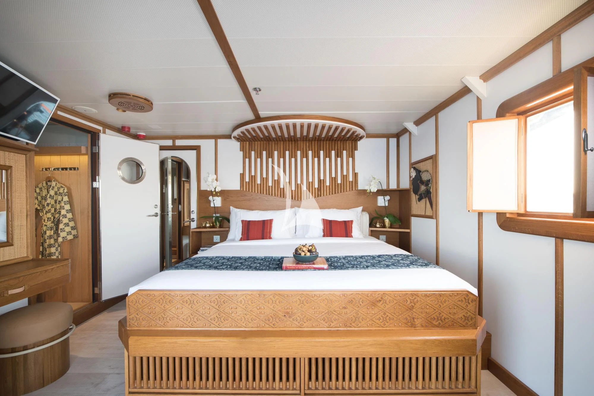 a large bedroom with a large bed aboard KUDANIL EXPLORER Yacht for Sale