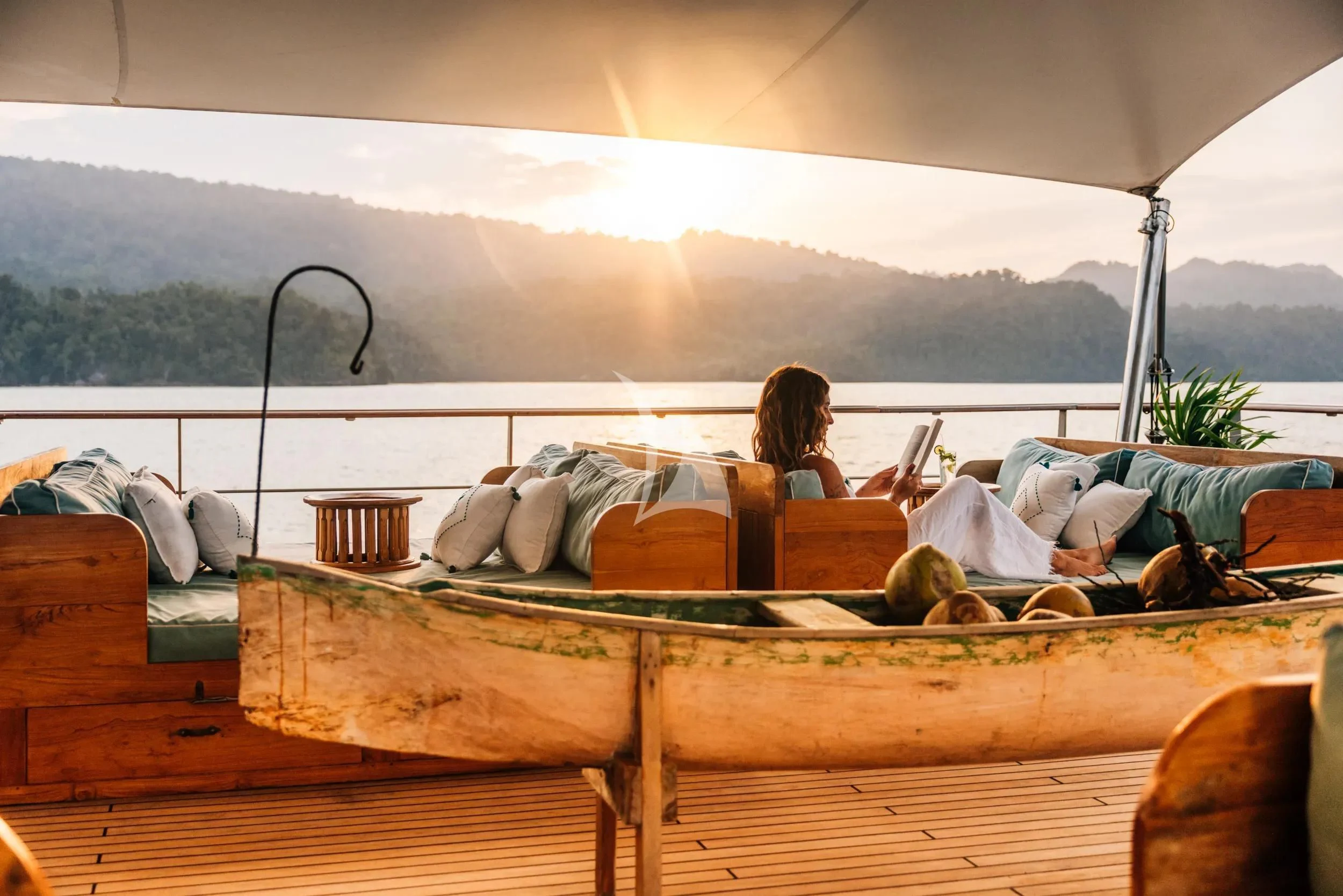 a person lying on a bed aboard KUDANIL EXPLORER Yacht for Sale