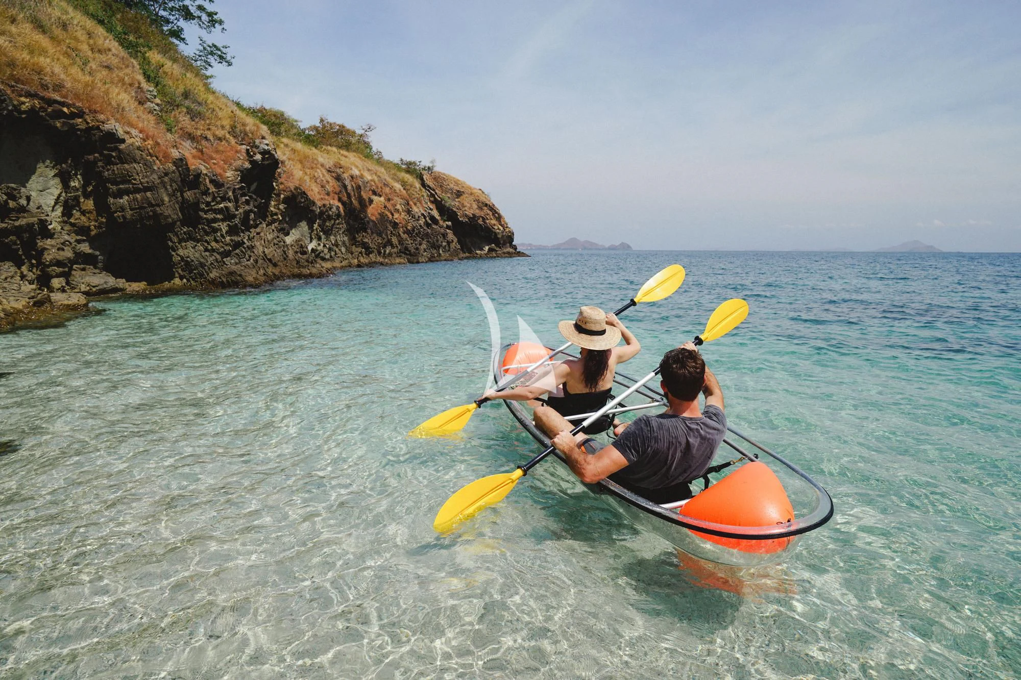 a man and woman in a canoe aboard KUDANIL EXPLORER Yacht for Sale