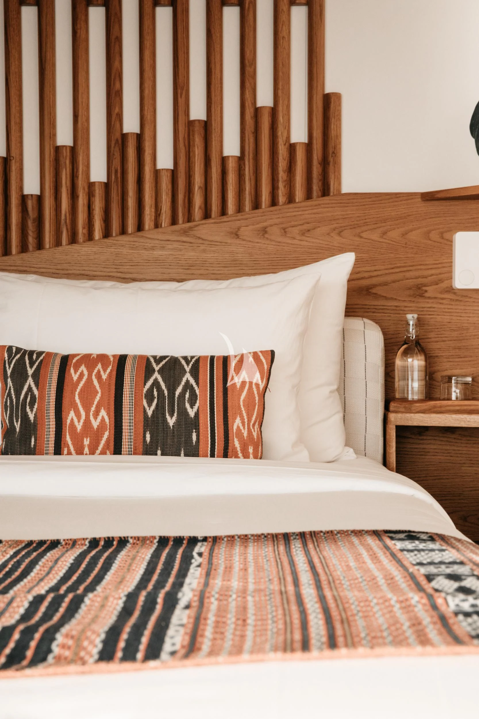 a bed with a striped blanket aboard KUDANIL EXPLORER Yacht for Sale