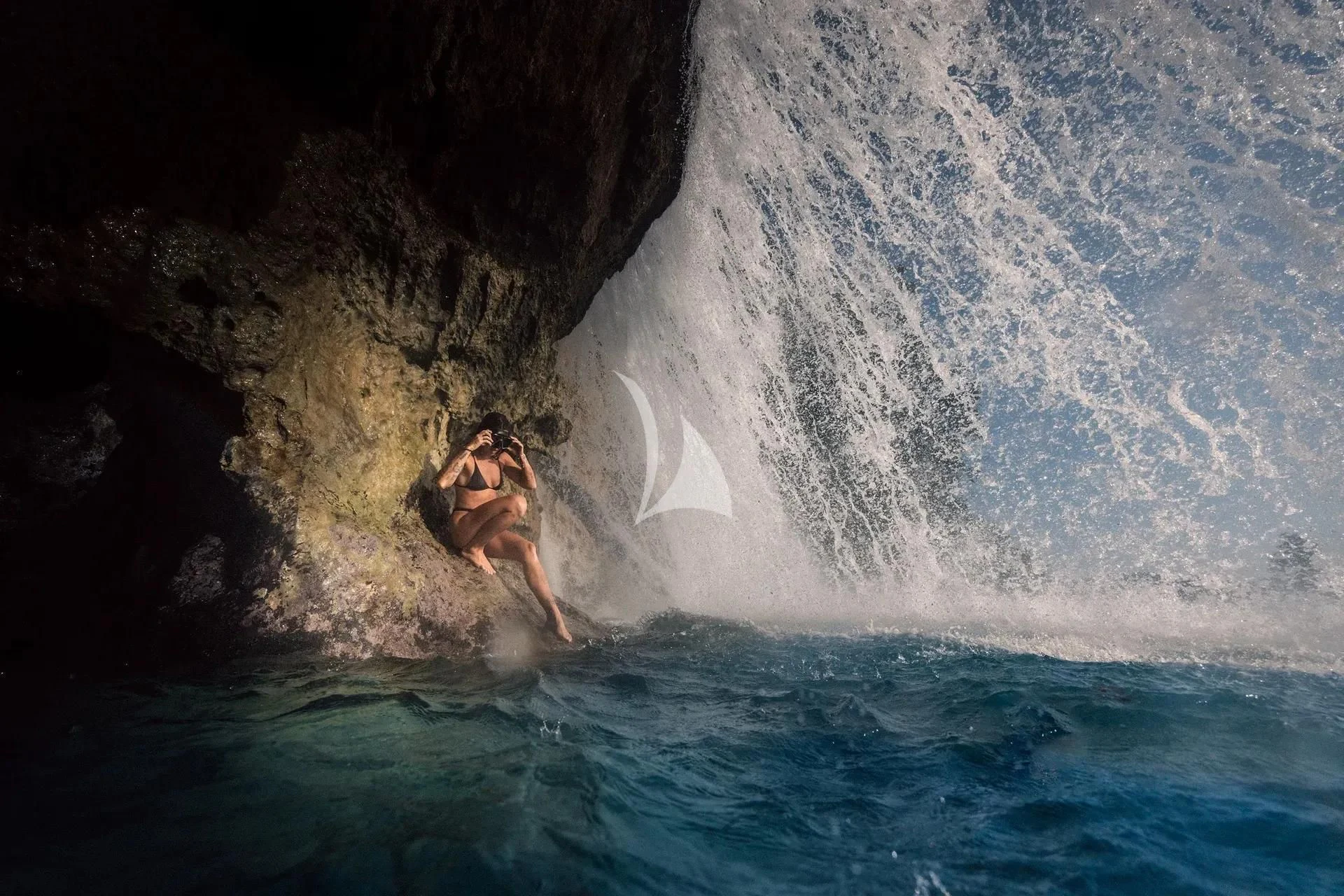 a person swimming in a body of water aboard KUDANIL EXPLORER Yacht for Sale