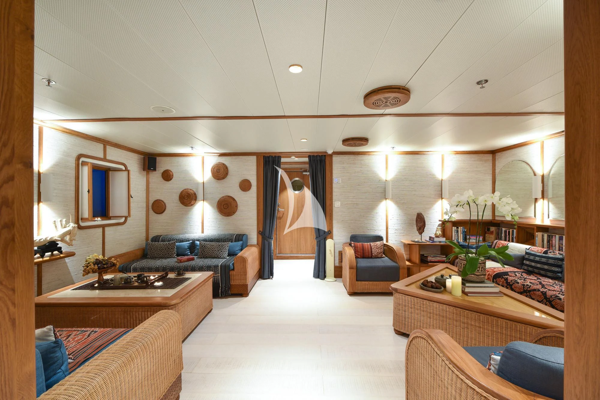 a living room with a large window aboard KUDANIL EXPLORER Yacht for Sale