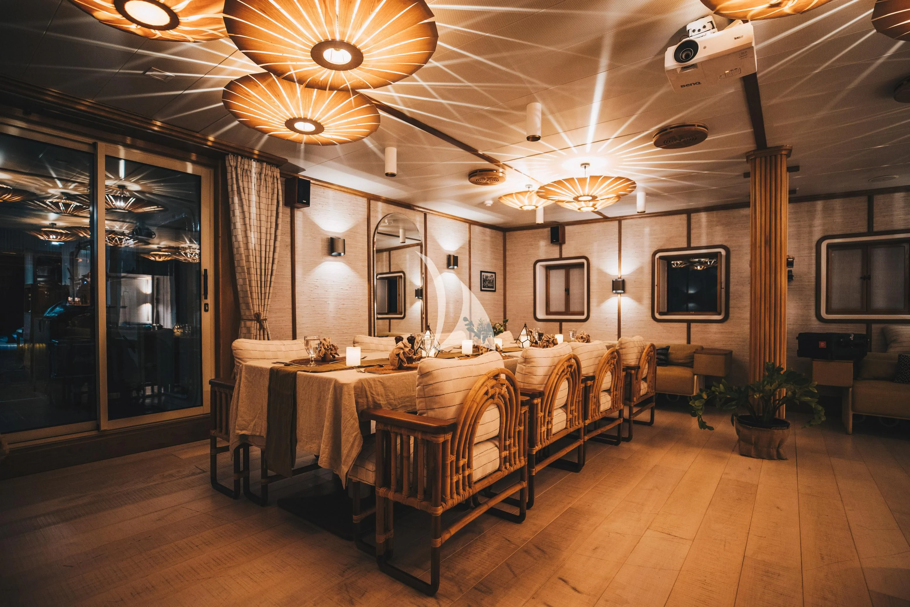 a room with tables and chairs aboard KUDANIL EXPLORER Yacht for Sale