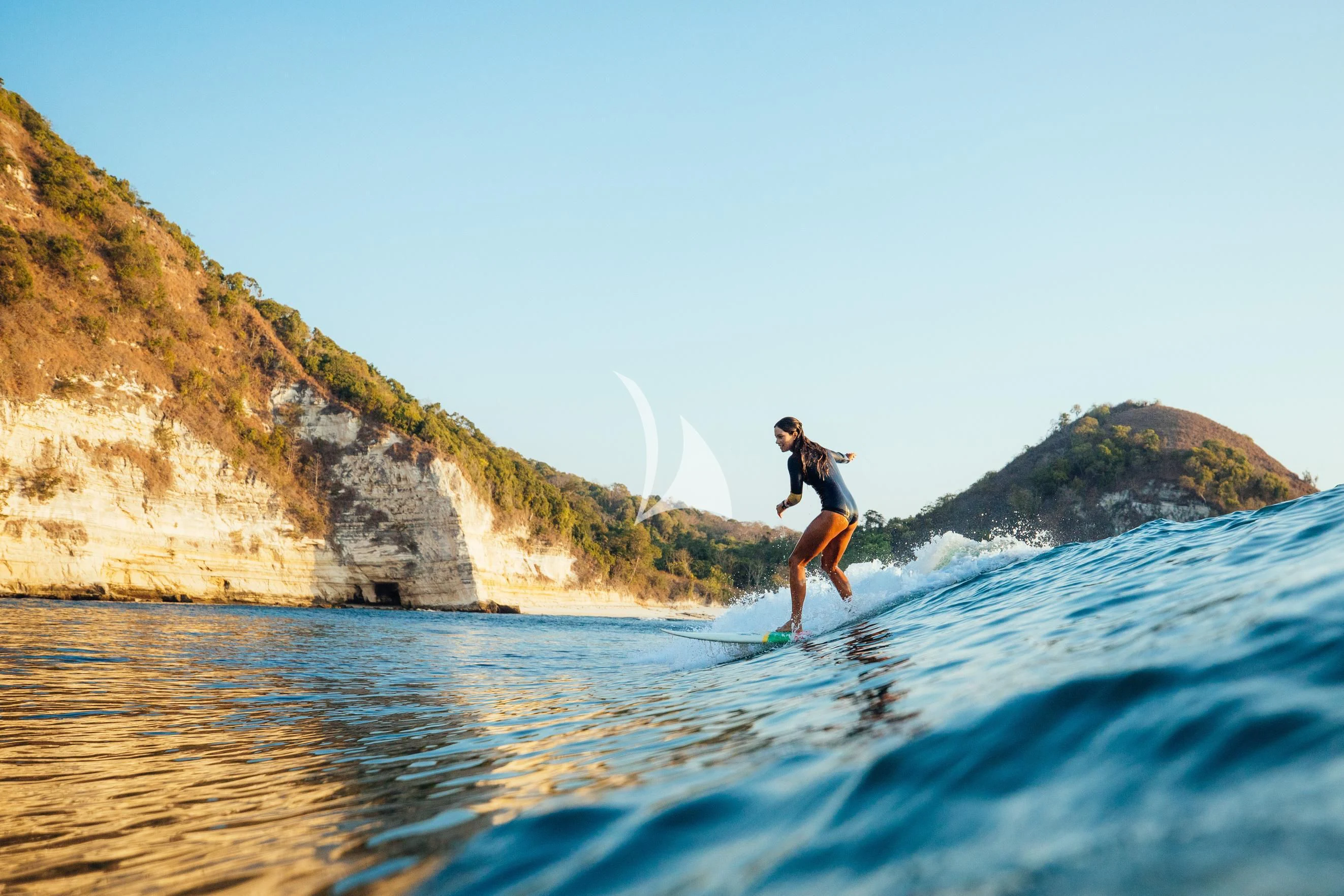 a man surfing on the sea aboard KUDANIL EXPLORER Yacht for Sale