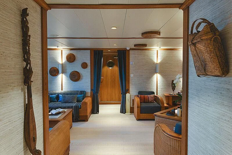 a room with a couch and a table aboard KUDANIL EXPLORER Yacht for Sale