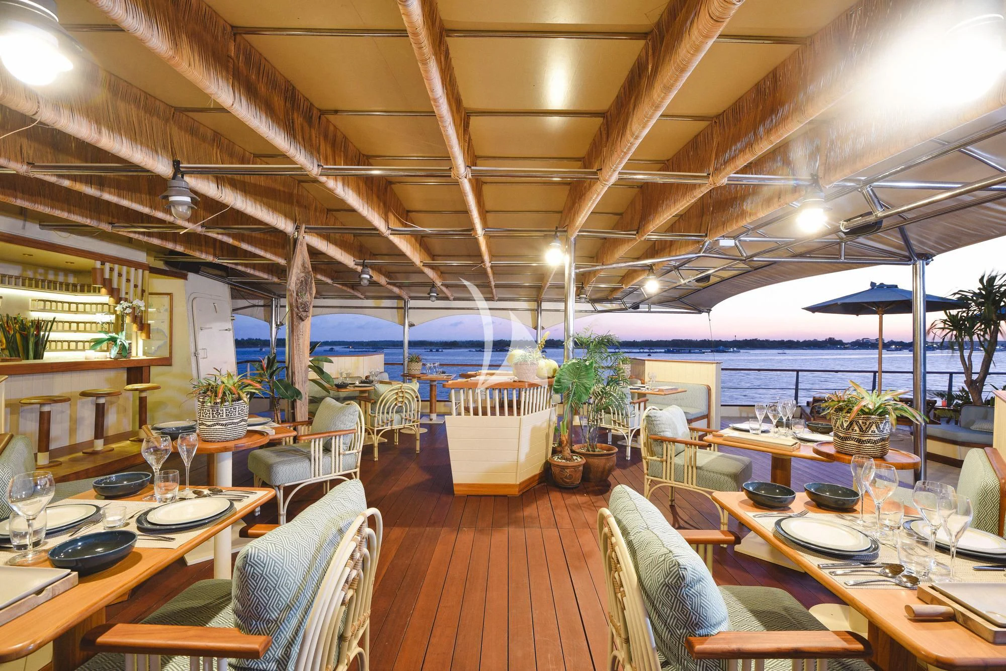 a restaurant with a large patio aboard KUDANIL EXPLORER Yacht for Sale